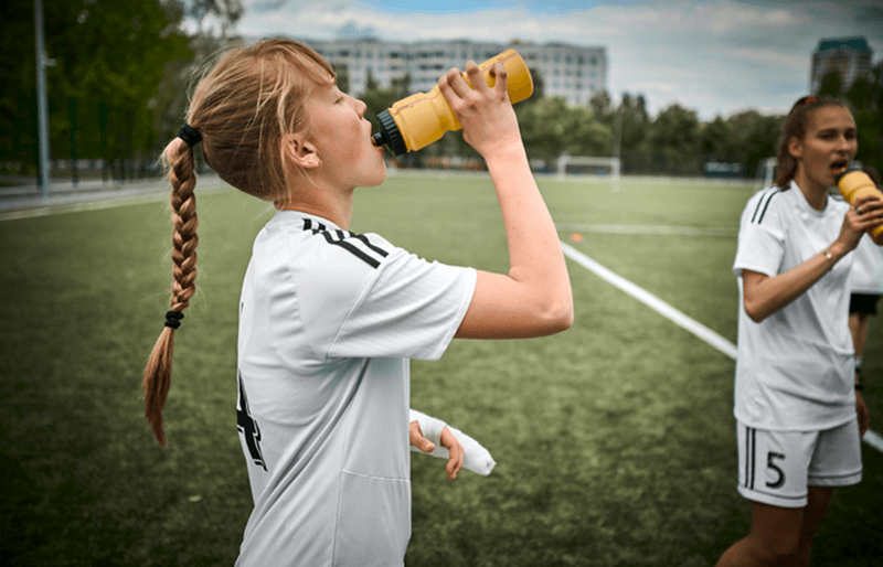 Footballer Drinking From Water Bottle